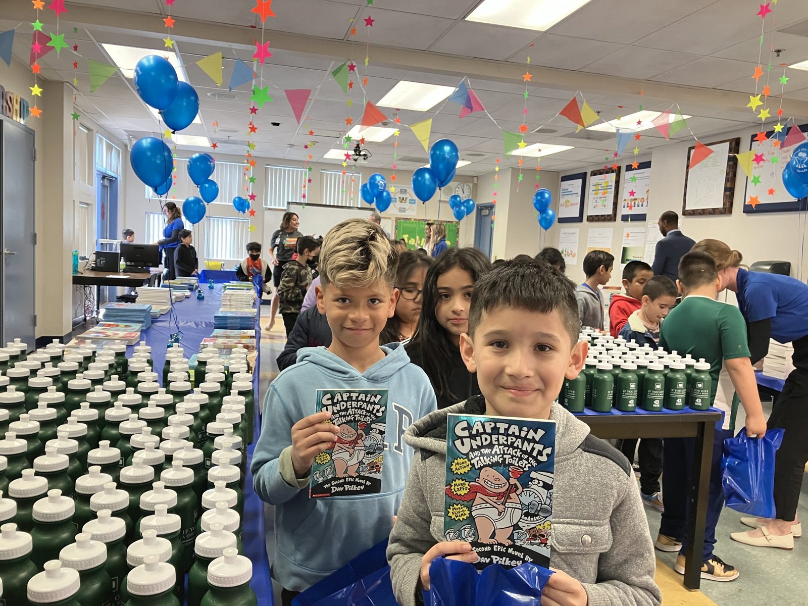 Young kids holding up